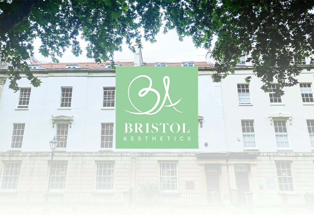 Bristol Aesthetic Logo with building in the background